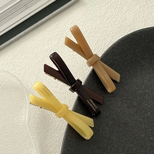 Elegant acetate bow hair clips in cream and brown with France Handmade lettering