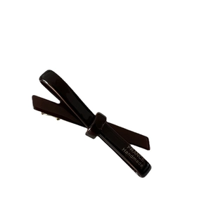 Elegant deep brown cellulose acetate bow hair clip with silver metal spring fastener