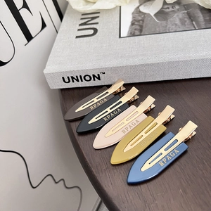 Five-piece set of stylish acetate hair clips in diverse colors with gold metal bases