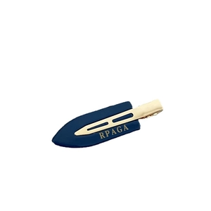 Navy blue acetate hair clip with gold metal and RPAGA lettering on white background