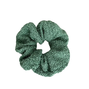 Premium dark green tweed hair scrunchie with textured knit fabric and elegant design