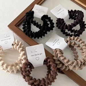 Set of 5 elastic spiral cable hair ties in earth-toned knit fabric for thick ponytails
