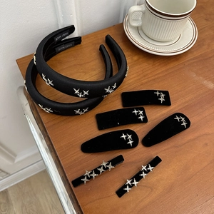 Detailed set of black velvet and satin headbands with sparkling silver rhinestone stars