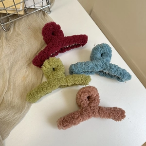 Set of four plush faux shearling hair claws in burgundy, green, blue and pink
