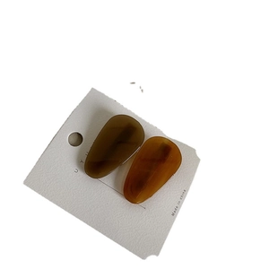 Paire de pinces à cheveux élégantes en acétate marron foncé et ambre écaille de tortue