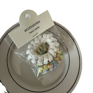 Set of 2 plush fleece spiral hair ties with fuzzy textures in a ceramic display bowl