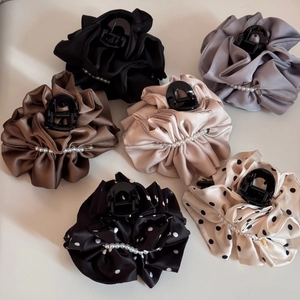 Satin fabric hair claws set with polka dots and pearl accents for bun hairstyles