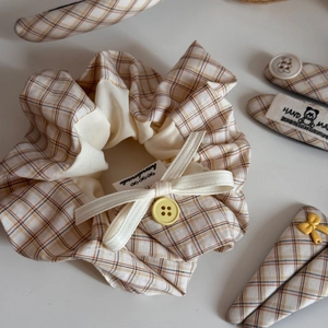 Detail view of yellow plaid scrunchie set with handmade bow and cute bear hair clips