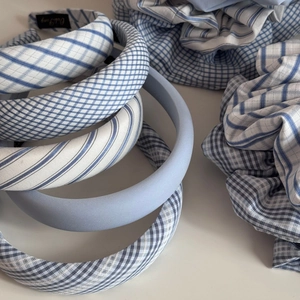 Detail of blue and white plaid fabric scrunchies and thick padded headbands set