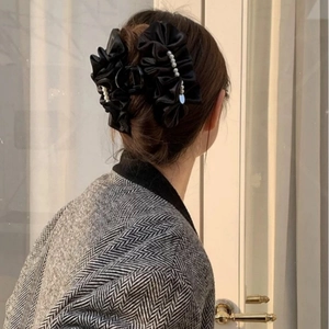 Polka dot pearl hair claw clip with black pleated fabric for elegant women's updo hairstyles