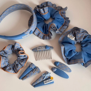 Detailed set of blue plaid fabric hair accessories including headbands and star clips