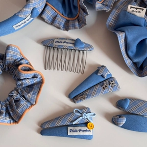 Blue plaid hair accessory set including star clips, hairbands, and bow ties on white background