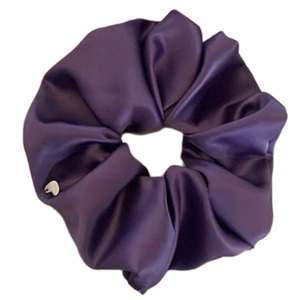Elegant purple satin oversized scrunchie with a silver heart charm on white background