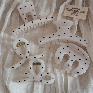French vintage polka dot cream white hair claw clip set of four on linen cloth