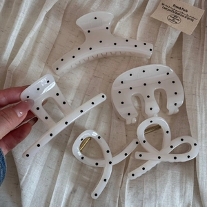 Elegant cream polka dot hair claws set in acetate material for French style hairstyles