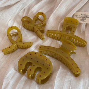 Five-piece set of olive green hair claws with red polka dots in various shapes