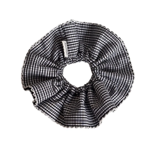 Classic black and white checkered scrunchie with lace edges and a handmade tag