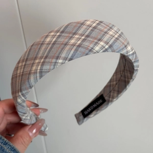 Detail shot of the thick handmade plaid headband fabric and inner handmade label