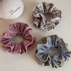 Three elegant checkered plaid scrunchies in pink, beige and blue with wavy edge trim