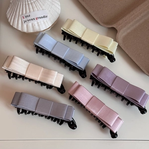 Detailed set of six Morandi satin ribbon bow banana hair clips in various elegant colors