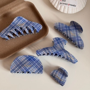 Blue checkered hair claw clips set including various shapes with gold logo detail