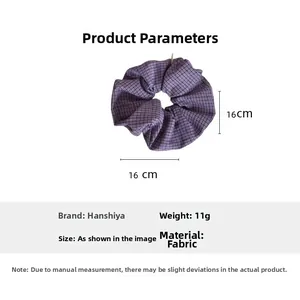Detail view of purple checkered fabric scrunchie showing 16cm outer diameter and 11g weight