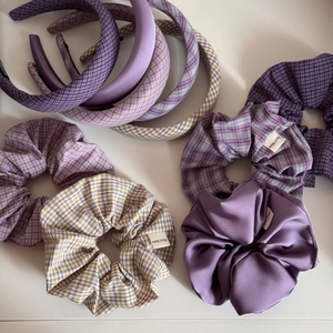 Detailed view of handmade purple plaid and satin scrunchies with padded headbands set