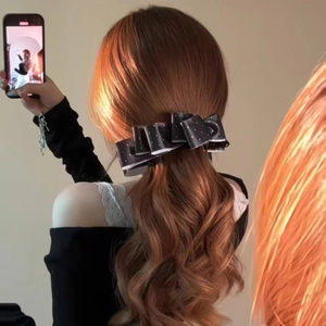Elegant black satin polka dot bow hair clip for high ponytail styling and hair decor