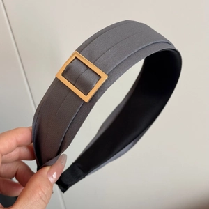 Detail showing grey satin headband with decorative gold square buckle and anti-slip lining