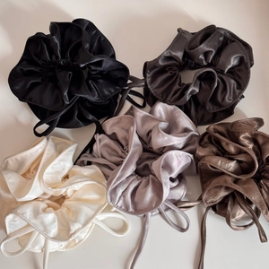 Glossy satin oversized scrunchies in five neutral colors with elegant ribbon ties