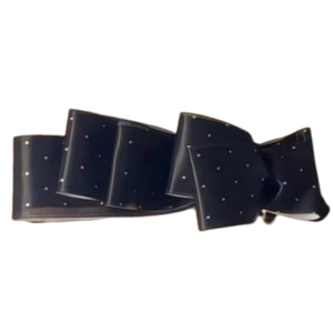 Elegant black satin polka dot bow hair clip with tiered design and vertical banana clasp