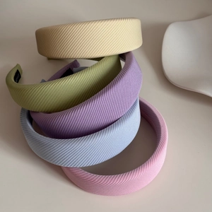 Set of minimalist macaron colored sponge headbands in soft textured twill fabric for women