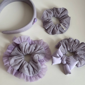 Close-up of lavender polka dot scrunchies and headband set with delicate lace details