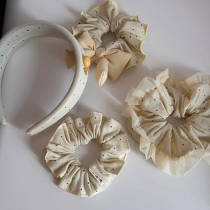 Detail of polka dot lace hair accessories set including headbands and scrunchies