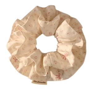 Floral scrunchie with pink patterns and handmade label for bun hairstyles