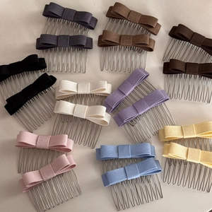 Flat lay of colorful bow hair side combs set featuring 16 pieces in assorted pastel shades