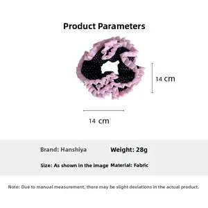 Detail showing pink lace hair scrunchie with black polka dots, 14cm size and fabric texture