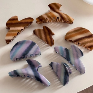 Set of 8 premium hair claw clips in elegant amber brown and purple blue gradient patterns