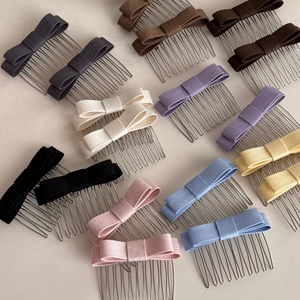 Flat lay of colorful fabric bow hair combs showing diverse color options and textures