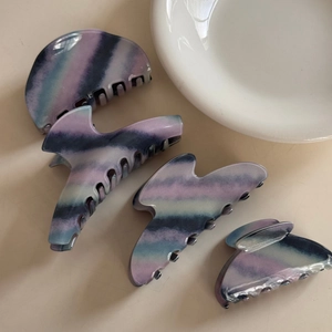 Set of four elegant marble purple hair claws with stylish smoke pattern finish