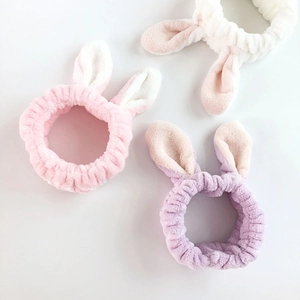 Three-piece set of plush rabbit ear headbands in pink, white, and purple for face washing