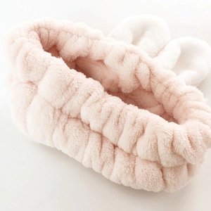 Soft pink plush rabbit ear headband for women, elastic coral fleece spa hair band
