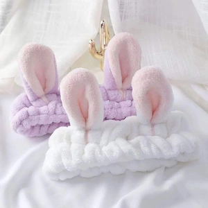 Cute plush rabbit ear headbands in white and lavender for skincare and makeup routines