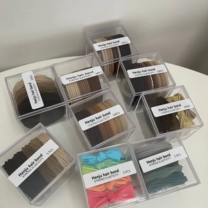High-elastic hair band set in assorted colors and patterns within transparent box