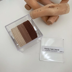 Set of 24 earth-toned high elasticity hair ties in a transparent storage box