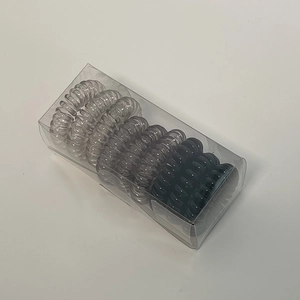 Set of 9 gradient spiral hair ties in transparent to black colors in a clear box
