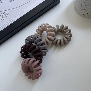 5-piece set of matte spiral telephone wire hair ties in earthy neutral color tones