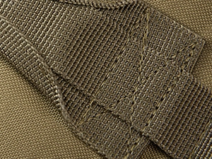Detail of durable nylon strap with reinforced stitching on a fishing shoulder bag