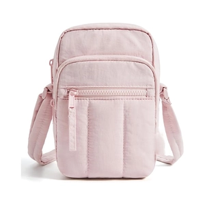 Detail view of pink nylon crossbody phone bag showing waterproof texture and zipper pockets