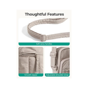 Detail view of quilted nylon bag showing soft padded handles and adjustable strap